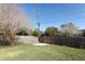 Fenced backyard with grassy area and concrete slab at 2201 Sunderland Rd, Maitland, FL 32751