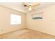 Bedroom with window, ceiling fan and carpet at 2201 Sunderland Rd, Maitland, FL 32751