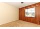 Bedroom with wood-paneled wall and carpet at 2201 Sunderland Rd, Maitland, FL 32751