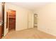 Bedroom with wood-paneled closet and carpet at 2201 Sunderland Rd, Maitland, FL 32751