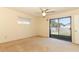 Bedroom with sliding door leading to the backyard at 2201 Sunderland Rd, Maitland, FL 32751