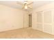 Bedroom with ceiling fan and closet at 2201 Sunderland Rd, Maitland, FL 32751