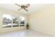 Bright dining room with large windows and ceiling fan at 2201 Sunderland Rd, Maitland, FL 32751