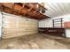 Spacious attached garage with overhead door at 2201 Sunderland Rd, Maitland, FL 32751