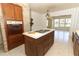 View of kitchen island, stovetop, and built-in oven at 2201 Sunderland Rd, Maitland, FL 32751