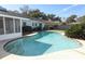 Inviting kidney shaped pool with concrete decking at 2201 Sunderland Rd, Maitland, FL 32751