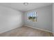 Empty bedroom with large window and wood-look floors at 2471 E 20Th St, Sanford, FL 32771