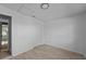 Clean and bright bedroom featuring wood-look floors and double doors at 2471 E 20Th St, Sanford, FL 32771