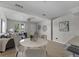 Open concept dining area with white round table and four light gray chairs at 2471 E 20Th St, Sanford, FL 32771