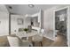 Modern dining area with white table and four chairs, near the kitchen at 2471 E 20Th St, Sanford, FL 32771