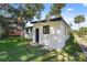 House exterior showcasing a side view and green lawn at 2471 E 20Th St, Sanford, FL 32771