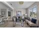 Open concept living room with gray sofa and two beige accent chairs at 2471 E 20Th St, Sanford, FL 32771