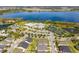 Aerial view of community with lake, tennis courts, and homes at 2507 Yellow Brick Rd, St Cloud, FL 34772