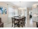 Dining area with wood table and chairs, adjacent to the kitchen at 2507 Yellow Brick Rd, St Cloud, FL 34772