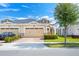 Well-kept townhome with a two-car garage and tidy landscaping for great curb appeal at 2507 Yellow Brick Rd, St Cloud, FL 34772