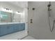 Modern bathroom with double vanity, frameless shower, and bronze fixtures at 2510 Amherst Ave, Orlando, FL 32804
