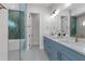 Luxurious bathroom with a double sink vanity, walk-in shower, and contemporary fixtures at 2510 Amherst Ave, Orlando, FL 32804