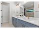 Modern bathroom featuring dual vanities, marble countertops, and sleek fixtures at 2510 Amherst Ave, Orlando, FL 32804