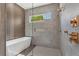 Bathroom with a large walk-in shower and a freestanding bathtub at 2510 Amherst Ave, Orlando, FL 32804