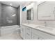 Bathroom with double vanity, quartz countertop, and subway tile backsplash at 2510 Amherst Ave, Orlando, FL 32804