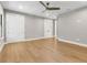 Large bedroom with hardwood floors, ceiling fan, and a double closet at 2510 Amherst Ave, Orlando, FL 32804