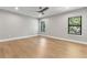 Spacious bedroom with hardwood floors, ceiling fan and a large window view at 2510 Amherst Ave, Orlando, FL 32804