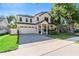 Two-story modern farmhouse exterior featuring an attached garage and a landscaped yard at 2510 Amherst Ave, Orlando, FL 32804