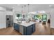 Open floor plan features a kitchen island flowing to the living room and backyard at 2510 Amherst Ave, Orlando, FL 32804
