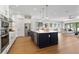 Open kitchen with stainless appliances, a center island and hardwood flooring at 2510 Amherst Ave, Orlando, FL 32804