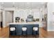 Modern kitchen with white cabinets, stainless steel appliances and an island with seating at 2510 Amherst Ave, Orlando, FL 32804
