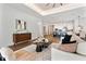 Open-concept living room with hardwood floors, modern furniture and a recessed ceiling at 2510 Amherst Ave, Orlando, FL 32804
