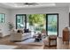 Open living room with view of the pool through large sliding glass doors at 2510 Amherst Ave, Orlando, FL 32804