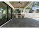 Outdoor kitchen with stainless grill, bar fridge, and open view to the pool at 2510 Amherst Ave, Orlando, FL 32804