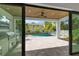 Covered patio with outdoor kitchen and view of the private backyard pool at 2510 Amherst Ave, Orlando, FL 32804