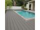 Backyard pool featuring cool blue water, gray composite decking, concrete pavers, and white vinyl fencing at 2510 Amherst Ave, Orlando, FL 32804