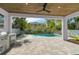 Inviting outdoor living space with custom pool, covered patio, and built-in grill for easy entertaining at 2510 Amherst Ave, Orlando, FL 32804