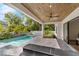 Back patio with beautiful wood ceilings, fan, tiled floor, and a refreshing swimming pool at 2510 Amherst Ave, Orlando, FL 32804