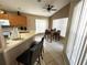 Eat-in kitchen with wood cabinets and tile flooring at 2564 Bear Creek Ct, Kissimmee, FL 34747