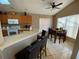 Eat-in kitchen with wood cabinets and tile flooring at 2564 Bear Creek Ct, Kissimmee, FL 34747