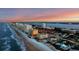 Coastal city skyline with beach and ocean at sunset at 2855 S Atlantic Ave # 304, Daytona Beach Shores, FL 32118