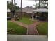 Brick-paved backyard with gazebo and multiple sitting areas at 2950 Omaha Dr, Deltona, FL 32738