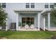 Covered patio with white chairs and privacy fence at 3164 Emerald Acres Ln, Sanford, FL 32771