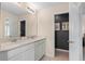 Double vanity bathroom with modern light fixtures and a sleek design at 3175 Emerald Acres Ln, Sanford, FL 32771