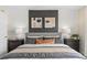 Main bedroom featuring a gray upholstered bed and modern nightstands at 3175 Emerald Acres Ln, Sanford, FL 32771