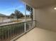 Screened balcony overlooking the parking lot and trees at 3300 Whitestone Cir # 101, Kissimmee, FL 34741