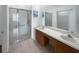 Double vanity bathroom with walk-in shower at 3300 Whitestone Cir # 101, Kissimmee, FL 34741