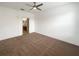 Spacious bedroom with neutral carpet and ceiling fan at 3300 Whitestone Cir # 101, Kissimmee, FL 34741