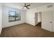 Spacious bedroom with large window and ceiling fan at 3300 Whitestone Cir # 101, Kissimmee, FL 34741