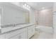 Bathroom boasts double vanity with granite countertop and shower/tub combo at 33339 Seattle Slew Dr, Sorrento, FL 32776