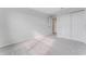 Light-filled bedroom with grey carpet and double doors at 33339 Seattle Slew Dr, Sorrento, FL 32776